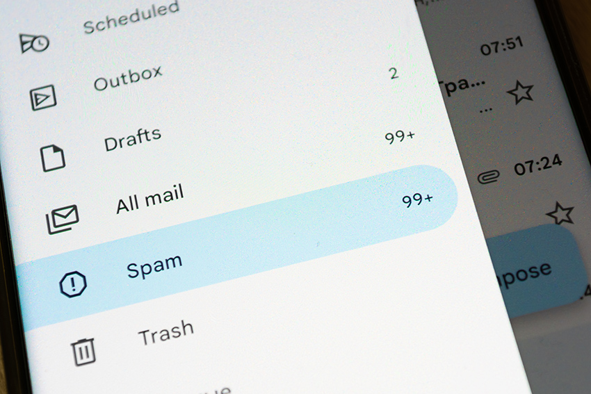 Image of phone with spam on email app